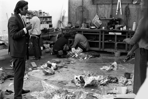 Body Bags: Newton Harrison with students preparing the piece