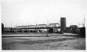 View looking southeast from point in Santa Fe yards north of 4th Street showing timber trusses, Los Angeles, 1930