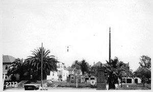 Hoover Street looking southeast toward Carondelet Street showing ornamental tract monument obstructing vision at southwest corner, Los Angeles, 1927