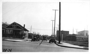 Looking easterly on 36th Street from San Pedro Street showing practice of storing old worn out trucks along curb, Los Angeles, 1928