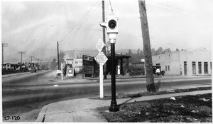 New type caution flasher installed by L.A. City Signal Department at intersection of Griffith Park Boulevard and Hyperion Avenue, Los Angeles, 1927