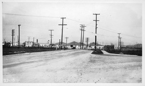 Grade crossing Mission Road, Alhambra, over S.P. Main Line west of Fremont Street, from east side of Mission Road south of tracks looking north across grade crosing. Pavement narrows down from 36 ft. between curbs south of tracks to 24 ft. at crossing. No