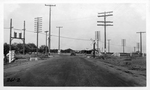 L.A. County Highway grade crossing with Central Avenue and A.T. & S.F. Ry. east of La Mirada, Los Angeles County, 1925