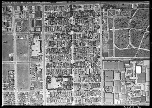 Aerial view of Cahuenga, Vine, & Gower, showing Hollywood Memorial Park at right, 1938