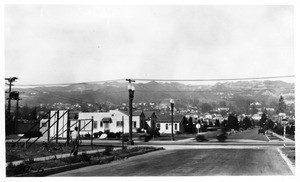 Looking northwesterly through southwest corner of Melrose and Westbourne Avenues, showing signs which were reported as obstructing vision of traffic, Los Angeles, 1930