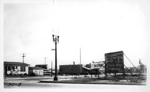 Looking southeasterly through the southwest corner of Melrose and Westbourne Avenues, showing signs which were reported as obstructing vision of traffic, Los Angeles, 1930