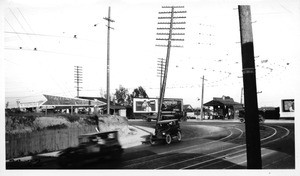 Looking easterly showing leaning pole at northwest corner of 7th and Boyle Avenue, Los Angeles, 1928