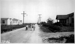 Looking easterly on Strawberry Street and Williams Street east of Hawthorne showing tree and hedge obstructing vision, Los Angeles County, 1928