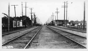 Florence Avenue Pacific Electric Long Beach Line grade crossing, looking south along center line of P.E. tracks, Los Angeles County, 1926