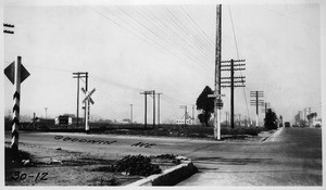 Looking northwesterly on San Fernando Road at Goodwin Avenue showing condition of curb at southwest corner, Los Angeles County, 1930