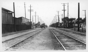 Florence Avenue Pacific Electric Long Beach Line grade crossing, looking north along center line of P.E. tracks, Los Angeles County, 1926