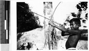 Boy using a bow and arrow, Oceania, ca. 1920-1940