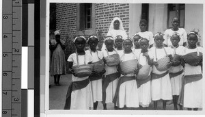 Group of girls holding baskets, Tanzania, Africa, ca. 1920-1940