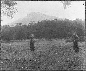 Two women in front of Mount Meru, Tanzania, ca. 1920-1930