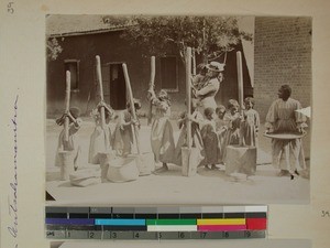 Girls from Antsahamanitra Girls' School pounding rice, Antananarivo, Madagascar, ca.1900