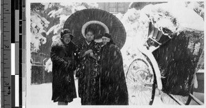 Sister Genevieve Beez, MM, standing in the snow with Agnes Cogan and a Japanese woman, Japan, 1927