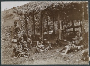 African women and children under a shelter for medical treatment, Tanzania