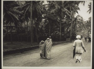 "Malabar - two Moplah women under one tuni covering their faces"