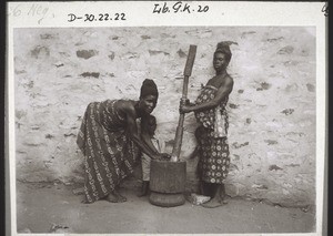 Two women preparing fufu