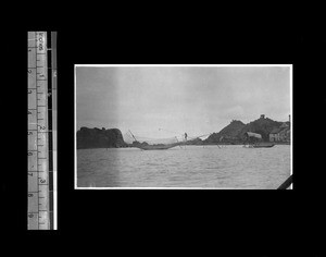 Man catching fish by nets, Shantou, Guangdong, China, 1921