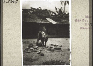 A woman making clay pots