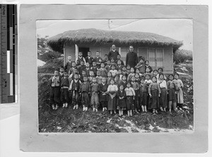 The Pied Piper and his followers, Chinnampo, Korea, 1932