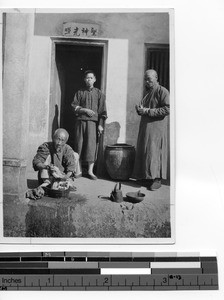 Three local men in Meixien, China, 1930