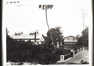 Botanical Garden in Victoria. Drying-plant for cocoa with a sliding roof; bridge over the Limpo river