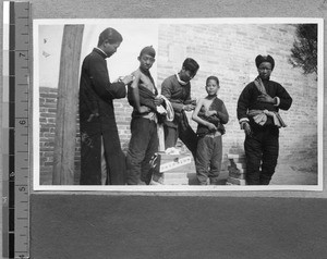 Harwood Bible Training School students performing health care on villagers, Fenyang, Shanxi, China, 1936