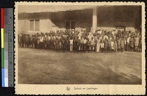 Pupils pose outside their school, congo, ca.1920-1940