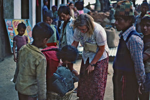 United Mission to Nepal. DSM/UMN Missionary and Teacher Tove Madsen with local people at Namjun