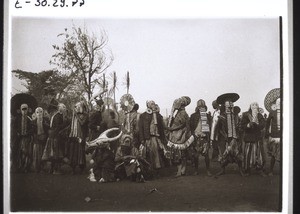 Foreign dancers with masks, in Fumban