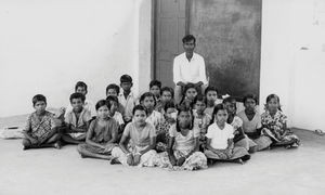 South Arcot District, India. Grade 5 children at the Neyveli School with their teacher, Mr. Dev