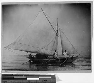 Three men on a sailing outrigger canoe, Philippines, 1911