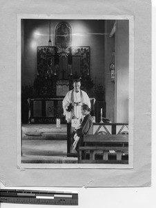 Fr. Phillip A. Taggart baptizes babies at Yangjiang, China, 1929