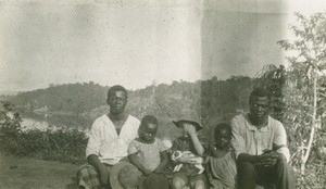 Gabonese people with a missionary child, in Gabon