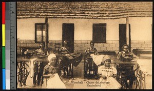 Children sewing outdoors before a thatched building, Congo, ca.1920-1940