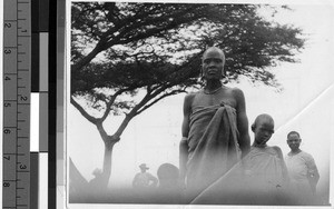 Grandmother and granddaughter standing outside, Africa, March 1948