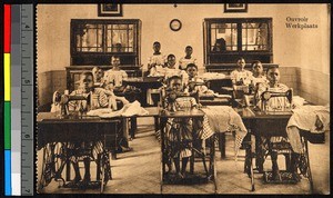 Children sewing on pedal-powered sewing machines, Congo, ca.1920-1940