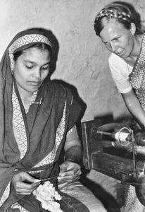 Chapai Nawabganj, Bangladesh, October 1981. DSM Missionary Tove Viftrup inspecting a woman spin