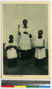 Boy bearing a thurible flanked by two other acolytes, India, ca.1920-1940