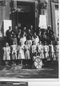 Bishop Raymond Lane with students at the Academy at Dalian, China