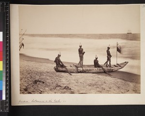 View of men in rowing boat on beach, India, ca. 1880-1890