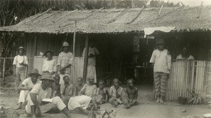 Children in front of a hut, in Gabon