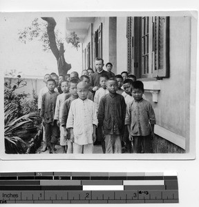 Maryknoll Brother with children in Hong Kong, China, 1925