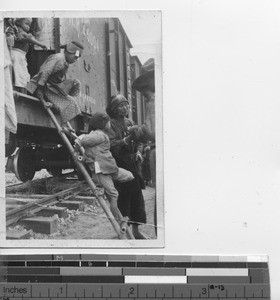 People coming off a train in Hong Kong, China, 1939