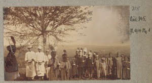 Group of African children with wind instruments and toy guns and uniform hats