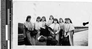 Eight Maryknoll Sisters standing in front of railroad tracks, Yeng You, Korea, ca. 1920-1940