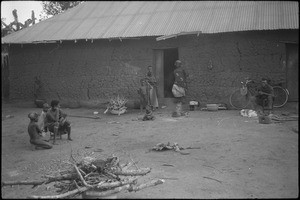 An African family in front of its home