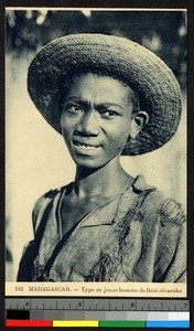 Young man wearing a straw hat, Madagascar, ca.1920-1940